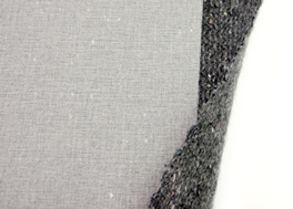 Processed yarn interlining for medium to heavy garments